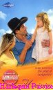 Couverture du livre intitulé "Un père à conquérir (Cowgirl makes three)"